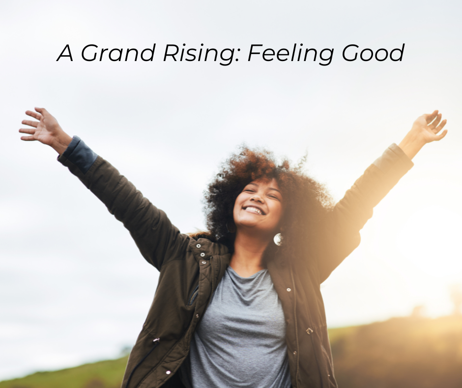 African American woman smiling with arms raised in joy. Text: A Grand Rising Feeling Good