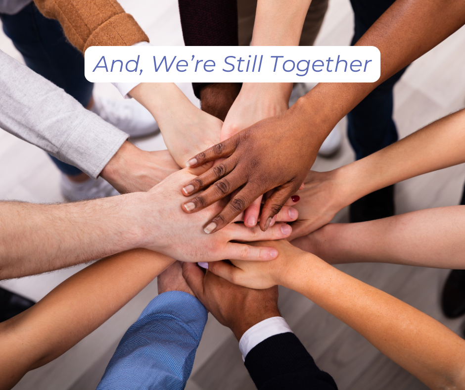 Overlapping hands at the center of a circle of people to signify "And, We're Still Together."