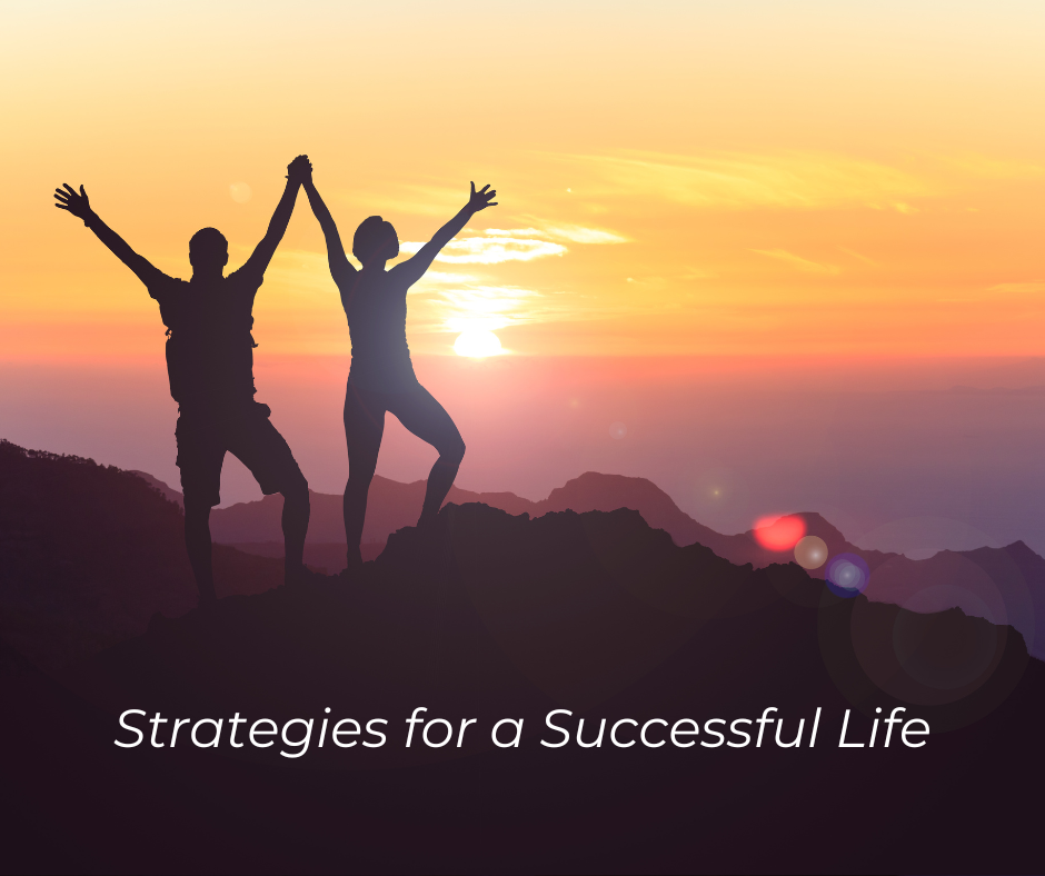 2 people on mountain top raised hands: Strategies for a Successful Life