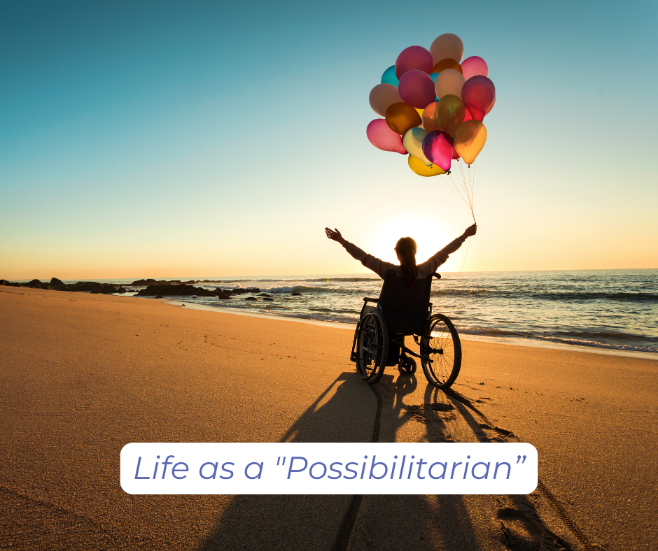 Life as a "Possibilitarian” A person in in a wheelchair on the beach, arms raised, holding a bouquet of colorful balloon