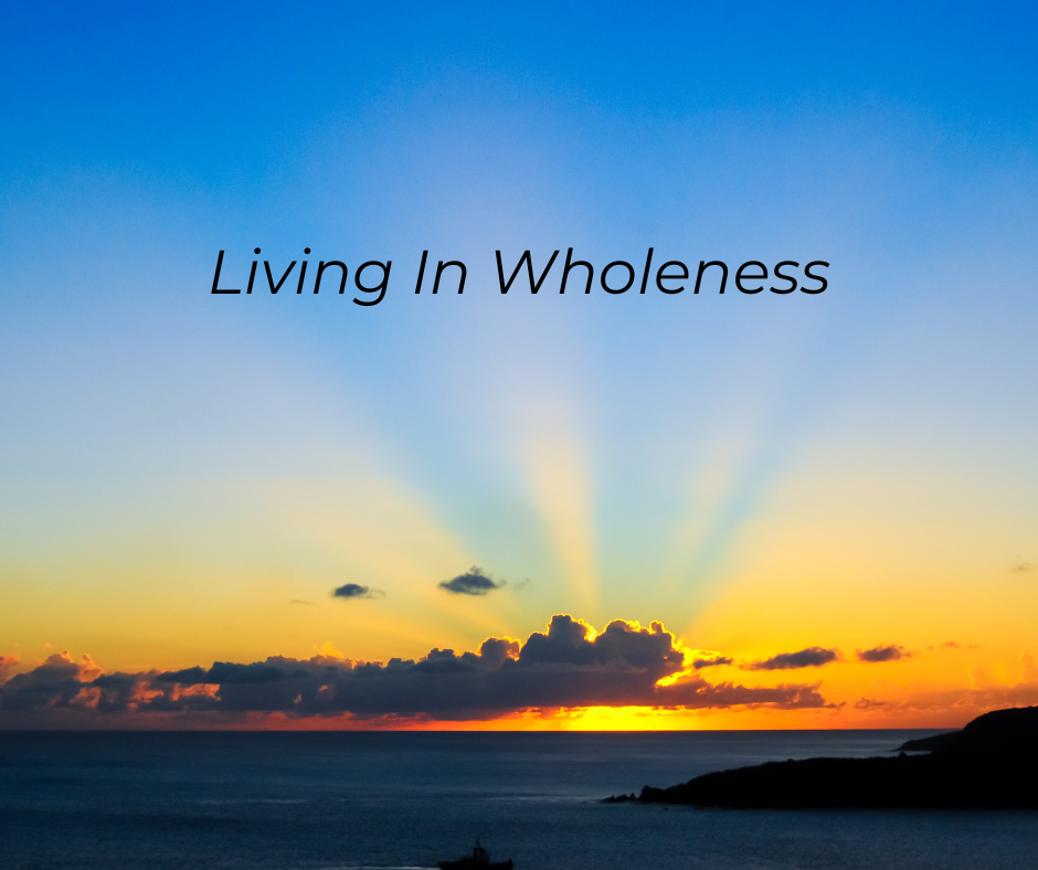a sunrise over the ocean. Text: Living In Wholeness