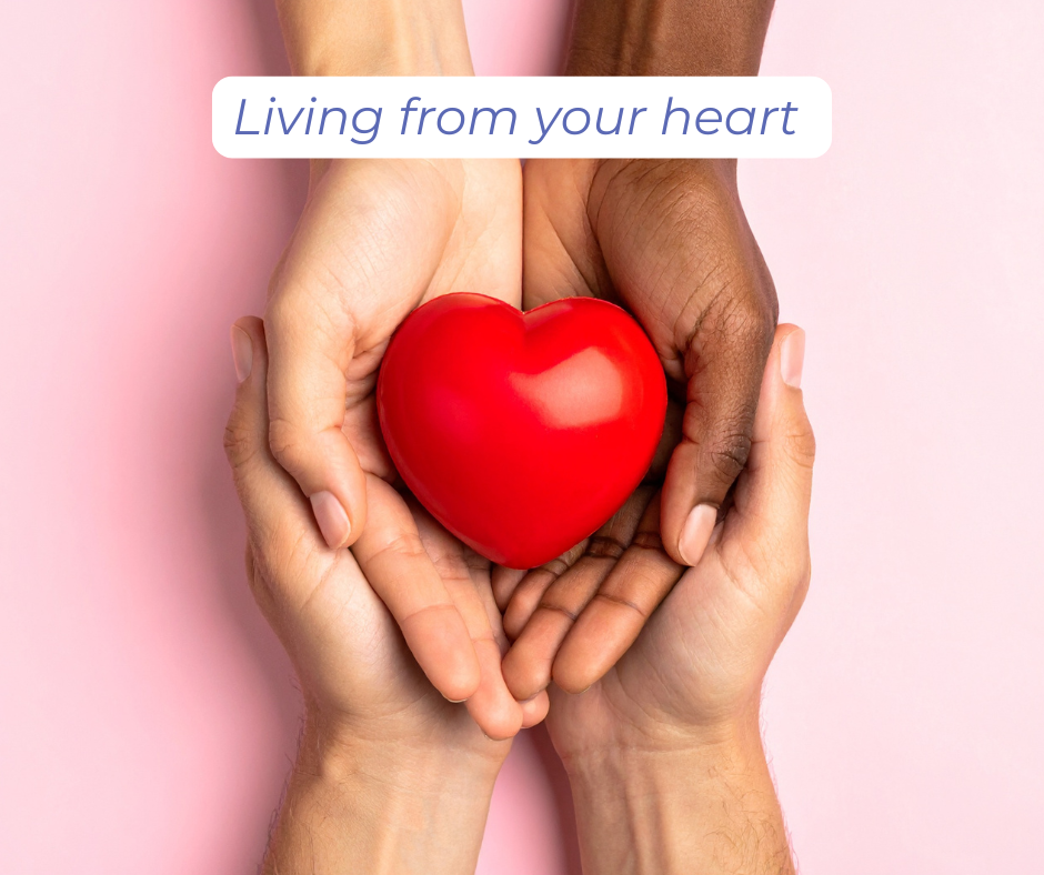 Living from your heart: hands holding a bright red, shiny heart