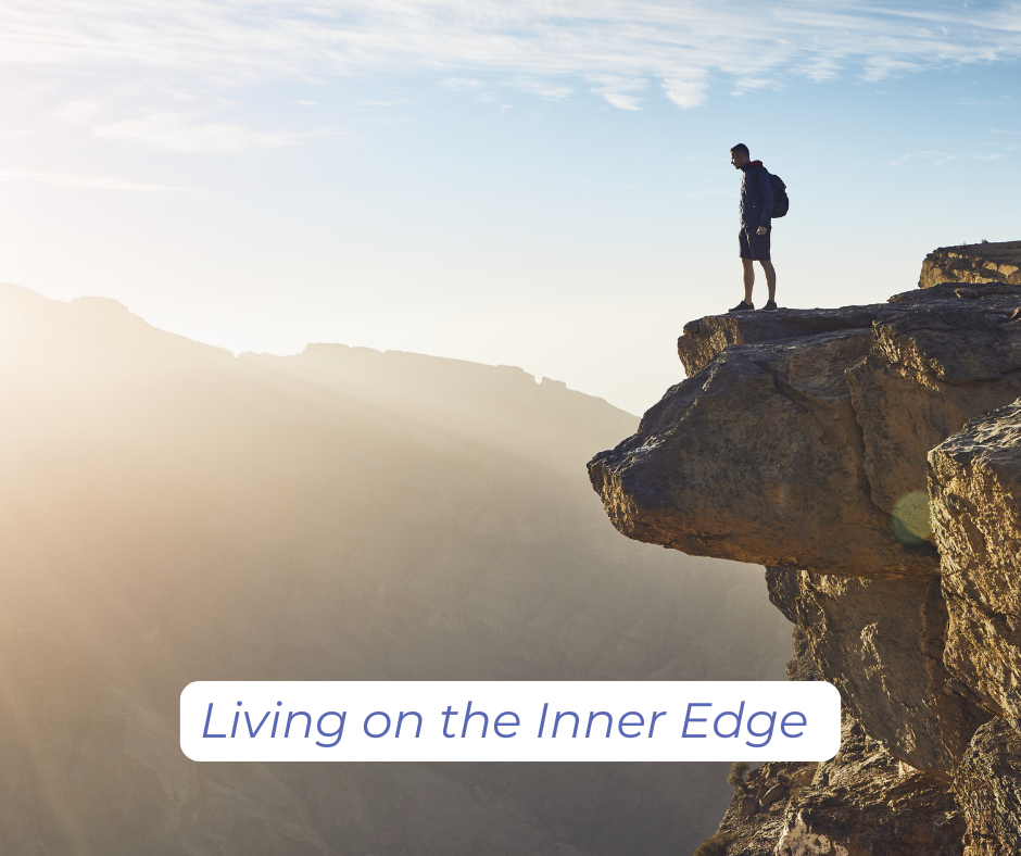 person standing on the edge of a cliff looking below, living on the edge