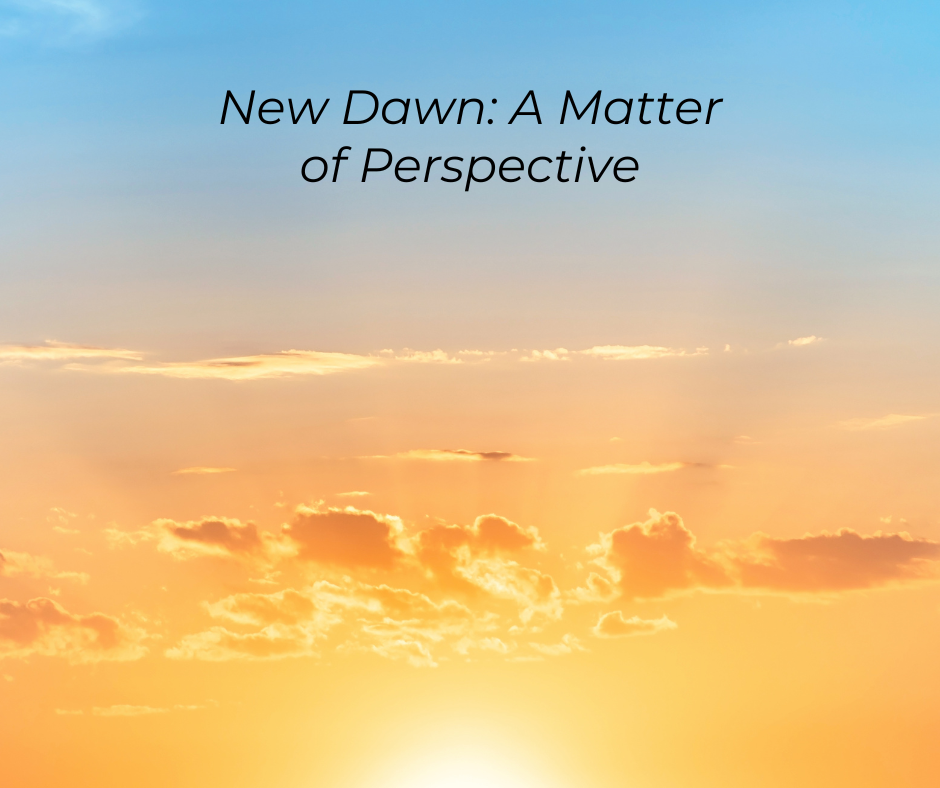 Sunrise with the text: New Dawn: A Matter of Perspective