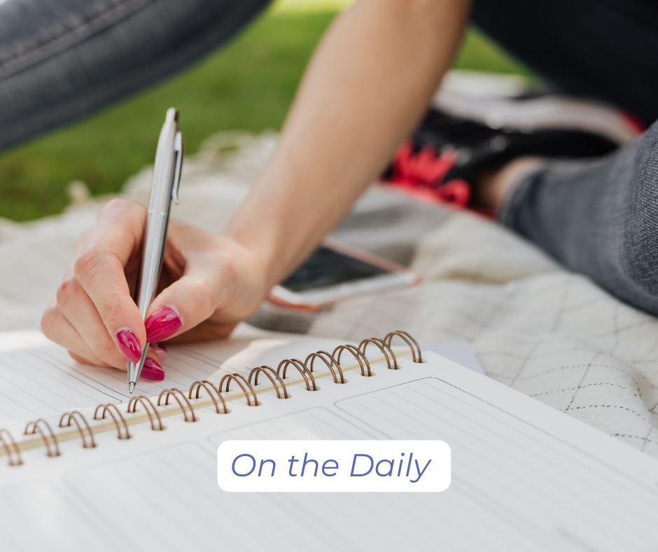 On the daily: A person writing in a daily planner