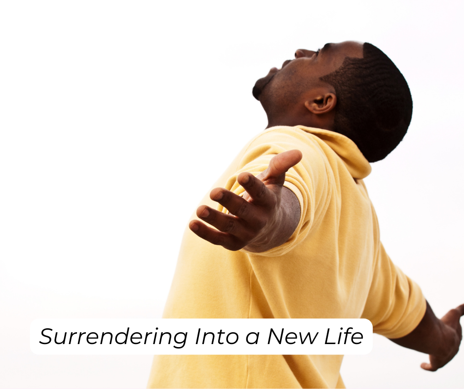 Man with arms stretched out to surrender into new life