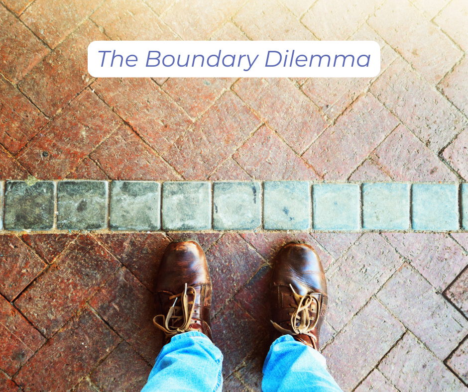 showing the shoes of a person standing at the edge of a boundary that is part of a design on the ground. The boundary dilemma