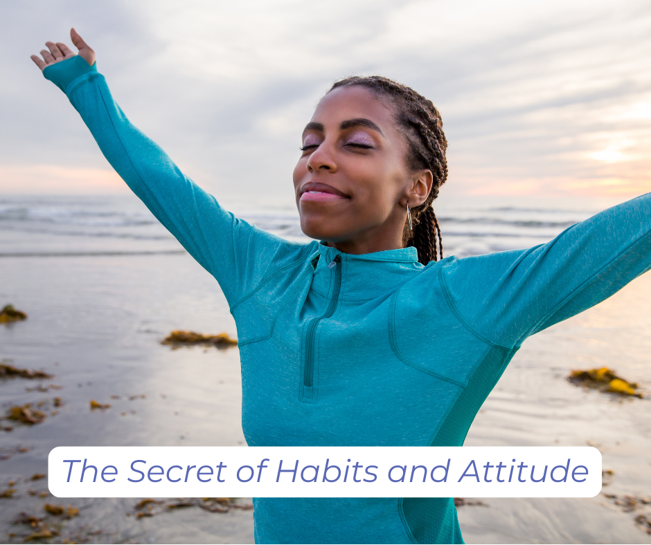 Smiling woman at the beach, arms raised in an additude of gratitude