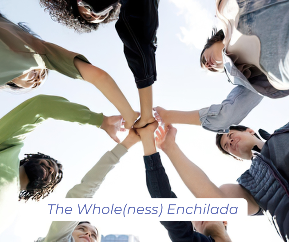 Whole(ness): A group of people in a circle give a high five together.