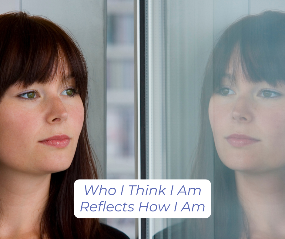 woman looking at a reflection of herself in a window