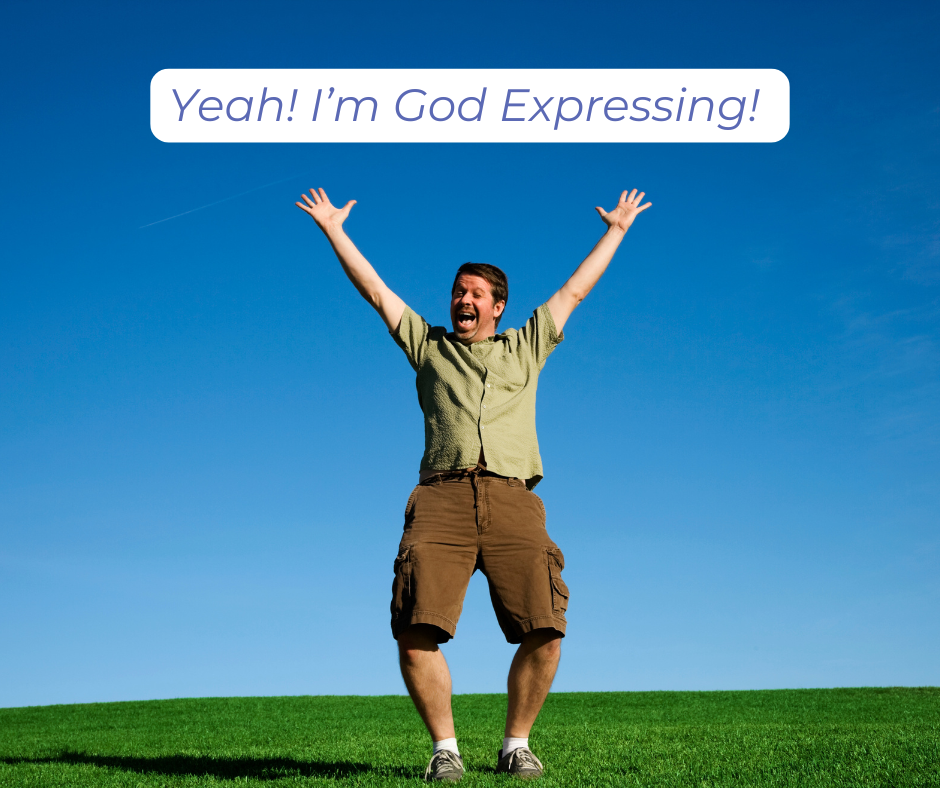 Man grinning with arms raised